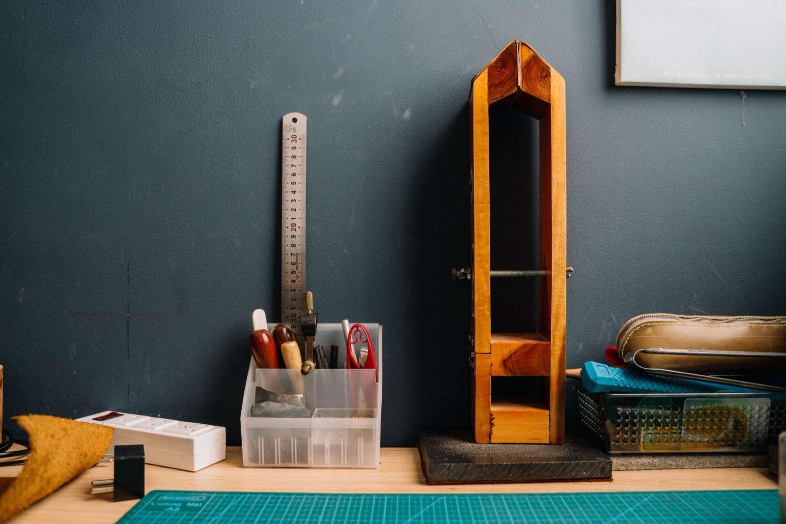 Workshop bench with divided storage, measuring tools, and a clear work surface