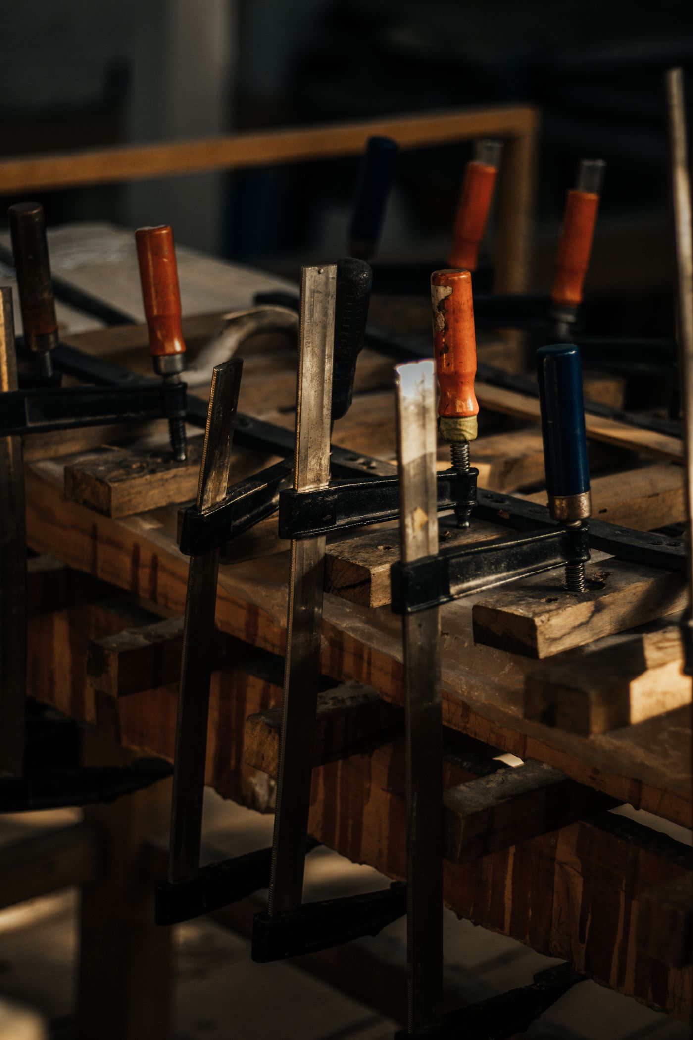 A real clamped woodworking assembly illustrates workholding context; these are not the shortlisted quick-grip products or our testing.